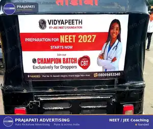 Auto rickshaw advertising in Nanded for a national NEET coaching brand — back-panel branding by Prajapati Advertising